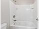 Bright bathroom features a white tub and shower combo with tiled walls at 368 Sawyer Meadow Way, Grayson, GA 30017