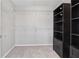 Spacious walk-in closet with wire shelving and a dark wood storage unit at 368 Sawyer Meadow Way, Grayson, GA 30017