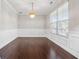 Elegant dining room features wainscoting, hardwood floors, and a chandelier at 368 Sawyer Meadow Way, Grayson, GA 30017