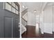Grand foyer with hardwood floors, staircase, and a view into the living area at 368 Sawyer Meadow Way, Grayson, GA 30017