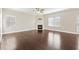 Spacious living room with a fireplace, hardwood floors and large windows at 368 Sawyer Meadow Way, Grayson, GA 30017