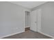 Bedroom featuring carpeted floors, closet, and neutral walls at 944 Joseph E Boone Nw Blvd, Atlanta, GA 30314