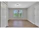 Bright bedroom with natural light, wood floors, closet, and neutral paint at 944 Joseph E Boone Nw Blvd, Atlanta, GA 30314