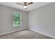 Neutral bedroom with carpeted floors, ceiling fan, and ample natural light at 944 Joseph E Boone Nw Blvd, Atlanta, GA 30314