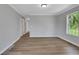 A bedroom with durable wood floors, a window, and a doorway leading to more rooms at 944 Joseph E Boone Nw Blvd, Atlanta, GA 30314