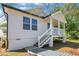 Charming cottage-style home with a red front door and elevated porch, perfect for enjoying the outdoors at 944 Joseph E Boone Nw Blvd, Atlanta, GA 30314