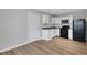 Efficient kitchen features white cabinets, granite countertops, and black appliances at 944 Joseph E Boone Nw Blvd, Atlanta, GA 30314
