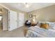 Bedroom with a bed, ceiling fan, and natural light, creating a relaxing retreat at 11265 Musette Cir, Alpharetta, GA 30009