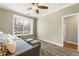 Comfortable bedroom features a daybed and an ensuite bathroom for added convenience and privacy at 11265 Musette Cir, Alpharetta, GA 30009