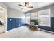 Bonus room with three windows, chair, custom wall trim, and carpet at 11265 Musette Cir, Alpharetta, GA 30009