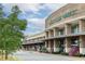 Grocery store featuring well-maintained landscaping, outdoor seating, and plentiful flowers at 11265 Musette Cir, Alpharetta, GA 30009