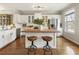 Well-appointed kitchen with white cabinets, butcher block island, and stainless steel appliances at 11265 Musette Cir, Alpharetta, GA 30009