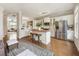 Bright kitchen featuring white cabinets, a butcher block island, and stainless steel appliances at 11265 Musette Cir, Alpharetta, GA 30009