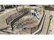Aerial view of a fenced playground with multiple structures including swings and a slide at 11265 Musette Cir, Alpharetta, GA 30009