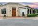 Charming restaurant features a brick facade, an inviting entrance, and covered patio seating at 11265 Musette Cir, Alpharetta, GA 30009