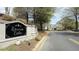 Community sign reads 'Westside Villas', with well-maintained grounds and a view of the neighborhood at 11265 Musette Cir, Alpharetta, GA 30009