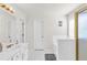 Bright bathroom features a white vanity, gold hardware, and a shower with sliding glass doors at 1211 Liverpool Pointe, Lawrenceville, GA 30046