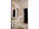 Bright bathroom featuring a vanity with storage and a separate room with a toilet at 1211 Liverpool Pointe, Lawrenceville, GA 30046