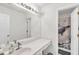 Bathroom features a spacious vanity, large mirror, and a shower with a unique curtain at 1211 Liverpool Pointe, Lawrenceville, GA 30046