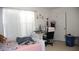 Cozy bedroom featuring bright natural light from a large window and a comfortable bed at 1211 Liverpool Pointe, Lawrenceville, GA 30046