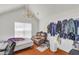 Bedroom with a vaulted ceiling, chandelier, and a bed with a brown leather couch at 1211 Liverpool Pointe, Lawrenceville, GA 30046