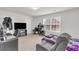 Bedroom featuring a bed, a desk, a gaming chair, and carpeted floors at 1211 Liverpool Pointe, Lawrenceville, GA 30046