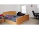Comfortable bedroom featuring ample natural light and neutral decor at 1211 Liverpool Pointe, Lawrenceville, GA 30046