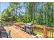 Outdoor deck with a grill and seating, ideal for summer barbecues and outdoor dining at 1211 Liverpool Pointe, Lawrenceville, GA 30046