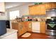 Cozy kitchen with granite countertops, stainless steel appliances, and wooden cabinetry at 1211 Liverpool Pointe, Lawrenceville, GA 30046