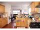 Charming kitchen with granite countertops, stainless steel appliances, and hardwood floors at 1211 Liverpool Pointe, Lawrenceville, GA 30046
