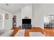 Open-concept living room boasting hardwood floors, high ceilings, and lots of natural light at 1211 Liverpool Pointe, Lawrenceville, GA 30046