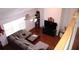 Bright living room with hardwood floors, a ceiling fan, and a sectional sofa at 1211 Liverpool Pointe, Lawrenceville, GA 30046