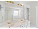 Main bathroom featuring double sinks, a large mirror, a separate tub, and shower enclosure at 1211 Liverpool Pointe, Lawrenceville, GA 30046