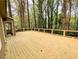 View of a freshly stained back deck with dark metal railings and a wooded backdrop at 2863 Landing Dr, Marietta, GA 30066