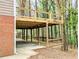 Exterior view of a raised deck with a lower-level patio and a brick wall on one side at 2863 Landing Dr, Marietta, GA 30066