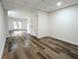 Finished basement with wood-look floors, white walls, and double doors leading to the outside at 2863 Landing Dr, Marietta, GA 30066