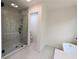 Bathroom showcasing tile flooring and glass shower with tub and storage at 2863 Landing Dr, Marietta, GA 30066