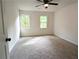 Bedroom featuring a ceiling fan, light gray carpet, and two windows at 2863 Landing Dr, Marietta, GA 30066