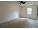 Neutral bedroom featuring a ceiling fan, carpet, and a window at 2863 Landing Dr, Marietta, GA 30066