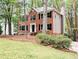 Charming brick two-story home with black shutters and a well-manicured lawn at 2863 Landing Dr, Marietta, GA 30066