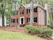 Charming brick two-story home with black shutters and a well-manicured lawn at 2863 Landing Dr, Marietta, GA 30066