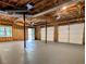 Spacious unfinished garage with three garage doors, exposed ceiling, and access to the backyard at 2863 Landing Dr, Marietta, GA 30066