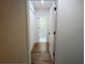 Hallway with hardwood floors and white doors at 2863 Landing Dr, Marietta, GA 30066