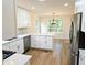 Bright open kitchen with stainless steel appliances, white countertops, and hardwood floors at 2863 Landing Dr, Marietta, GA 30066