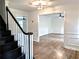 Elegant staircase leading into beautiful living room with hardwood floors at 2863 Landing Dr, Marietta, GA 30066