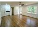 Bright living room with a fireplace, built-in bookshelves and gleaming hardwood floors at 2863 Landing Dr, Marietta, GA 30066