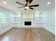 Bright living room with a fireplace, built-in bookshelves and gleaming hardwood floors at 2863 Landing Dr, Marietta, GA 30066