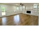 Bright living room with a fireplace, built-in bookshelves and gleaming hardwood floors at 2863 Landing Dr, Marietta, GA 30066