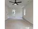 Spacious main bedroom showcasing carpet and ensuite bath with large windows at 2863 Landing Dr, Marietta, GA 30066