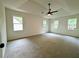Spacious main bedroom featuring neutral carpet, tray ceilings, and natural light at 2863 Landing Dr, Marietta, GA 30066